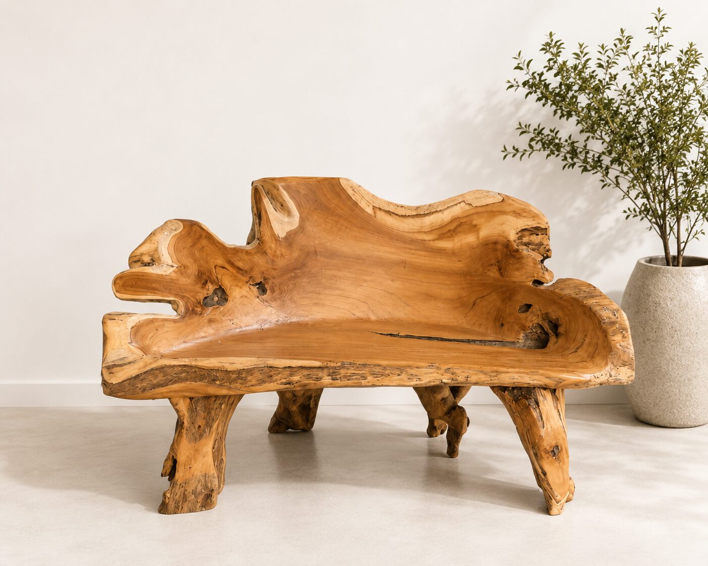 Rustic wooden bench with plant beside it.